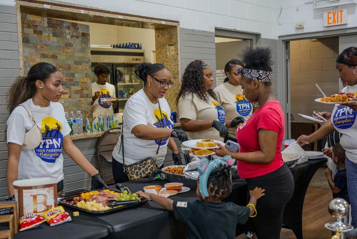 Volunteers serving the complimentary meal